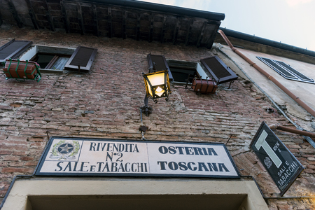 Certaldo Firenze, Italy - july 26, 2017; signboard of Typical Tuscan tavernのeditorial素材