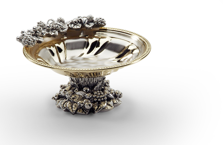 Isolated round bowl in steel and gold decorated with center footの写真素材