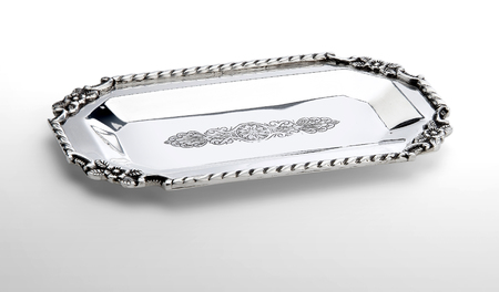 small engraved silver tray isolated on white backgroundの写真素材