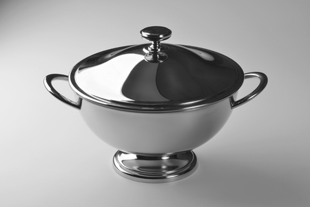 large glossy steel bowl with lid isolated on white backgroundの写真素材