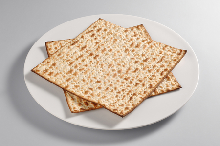 Round dish with Azimo bread isolated on grey backgroundの写真素材