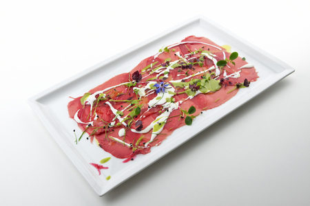 Plate with Red tuna carpaccio inspired by Pollockの写真素材