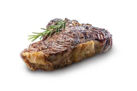 Whole grilled T-bone steak with rosemary isolated on white backgroundの写真素材
