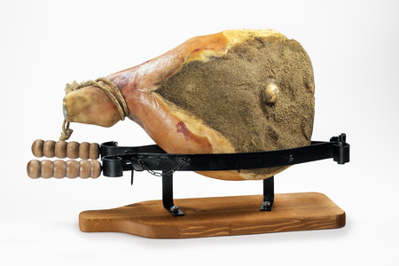 Whole Parma ham in the vice isolated on white backgroundの写真素材