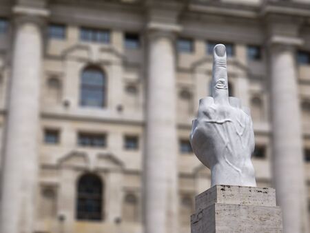 Milan, Italy - May 25, 2019: Mezzanotte Palace facade and middle finger sculpture in Milan Stock Exchange, symbol and heart of Italian financeのeditorial素材