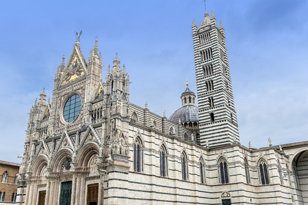 Facade and bell tower of the medieval cathedral of Sienaのeditorial素材
