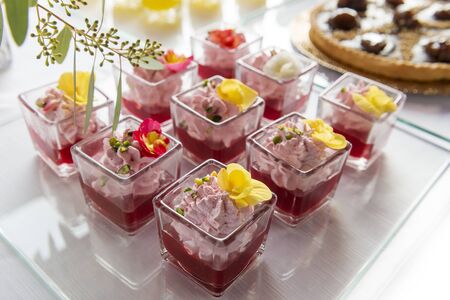 Detail of Dessert buffet in single portions of strawberry mousse