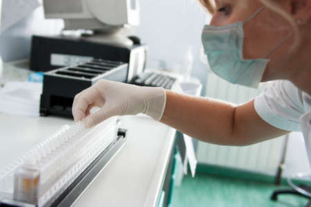 Milan, Italy - March 17, 2020: Preparation of racks with test tubes for medical laboratory analysis in an hospitalのeditorial素材