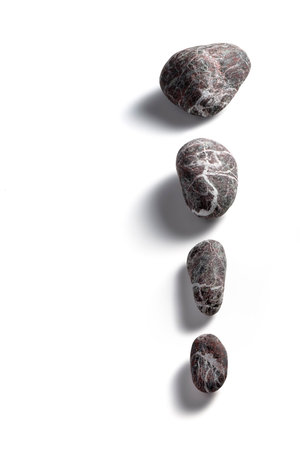 Composition of four pebbles on a white backgroundの写真素材