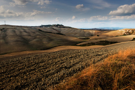 Tuscan landscape of the Sienese hills Autumn agricultural phases after the harvestの写真素材