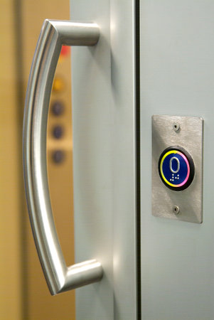 Detail of the lift door handle and call button