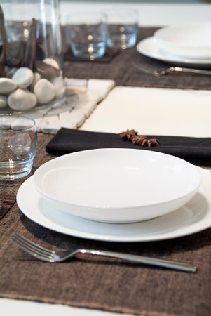 Table set in a modern setting with runnerの写真素材