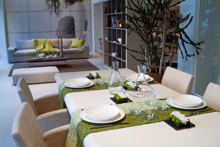 Table set in a modern setting with runnerの写真素材