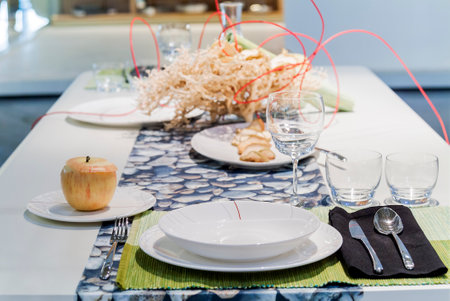 Table set in a modern setting with runnerの写真素材