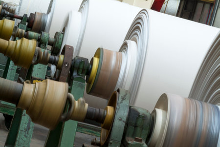 Perspective view of row of fabric rolls in textile industry