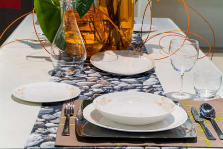 Table set in a modern setting with runnerの写真素材