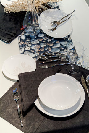 Table set in a modern setting with runnerの写真素材