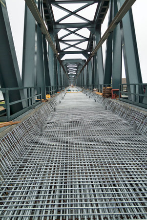 Perspective view of construction site with Reinforced structure for pouring concrete on a bridge deckの写真素材