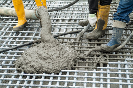 Concrete casting on Reinforcing Bar of floor in industrial Construction siteの写真素材