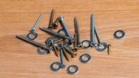Screws an washers in wood table