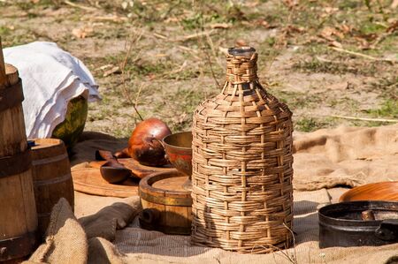 Bottle braided with dishes on the historical reconstruction of the medieval festival