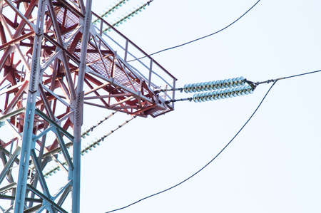 High-voltage power lines against the sky