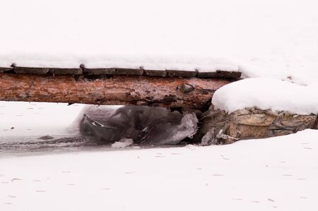 river, winter, snow on a foggy dayの写真素材