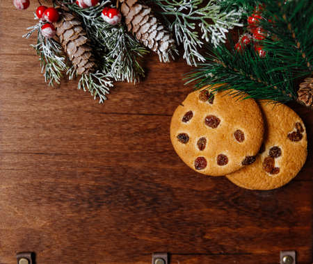 Festive Christmas and new year card with cookie on dark wooden backgroundの写真素材