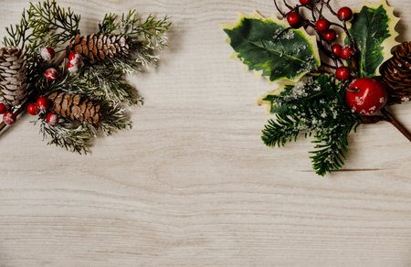 Festive Christmas and new year card with cone pine on gray wooden background