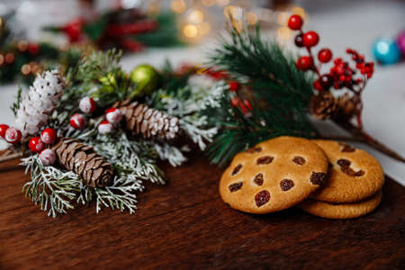 Festive Christmas and new year card with cookie on dark wooden backgroundの写真素材