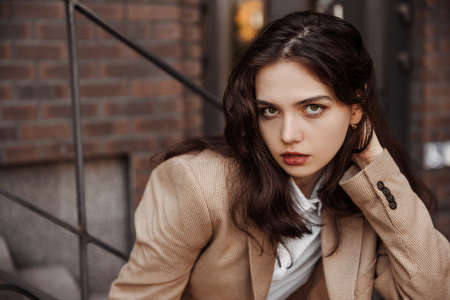 Close up portrait of young business woman of the modern office building backgroundの写真素材