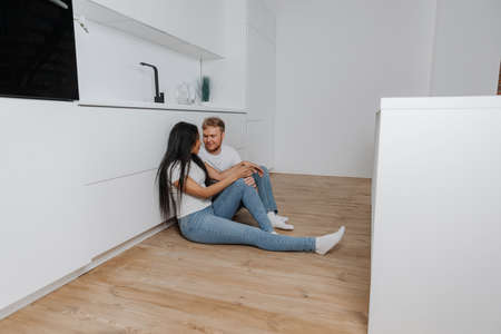 husband and wife talk and make plans for the future in their apartment