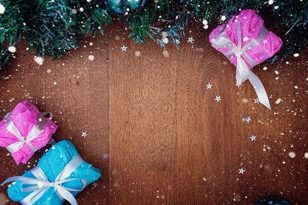 Wooden Christmas background with gift boxes around the perimeter. Wood background. Background, texture. Copy space.の写真素材