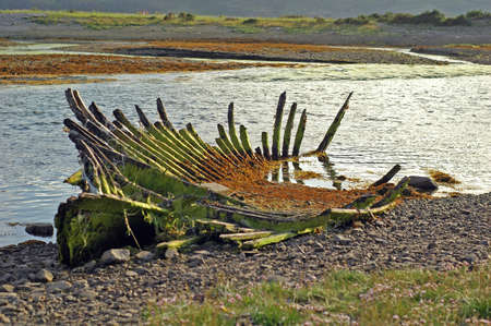Decrepit frame of an old rowing boatの写真素材