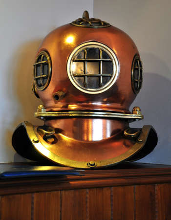 A copper plated antique divers helmet on displayの写真素材