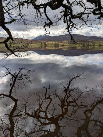Reflection on clear water, Loch Rannoch, Scotlandの写真素材