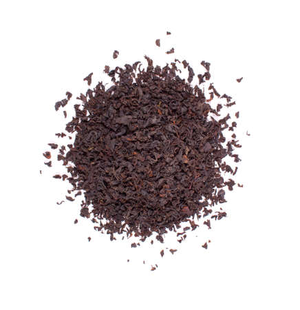 The pile of the dry tea leaves isolated on white background.の写真素材