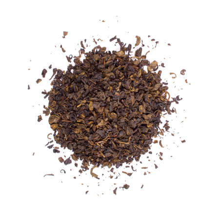 The pile of the dry tea leaves isolated on white background.の写真素材