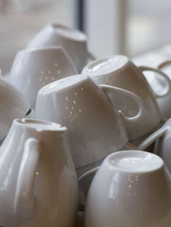 Washed white inverted coffee cups の写真素材