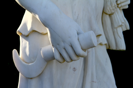 Hand of white female marble statue close up on black backgroundの写真素材