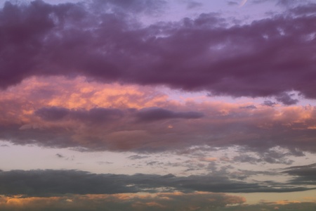 beautiful bright sun colored partially cloudy sky for using as background in design.