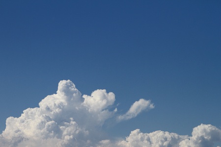 Beautiful vivid cumulus clouds for using as background in design.