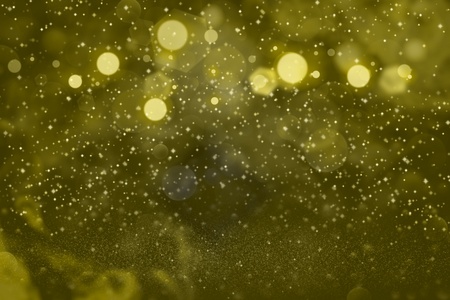 yellow nice glossy abstract background glitter lights with sparks fly defocused bokeh - festival mockup texture with blank space for your contentの写真素材