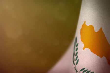 Cyprus hanging flag for honour of veterans day or memorial day on yellow dark velvet background. Cyprus glory to the heroes of war concept.の写真素材