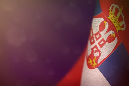 Serbia hanging flag for honour of veterans day or memorial day on purple dark velvet background. Serbia glory to the heroes of war concept.の写真素材