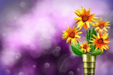 Beautiful live gazania bouquet bouquet in modern metal vase on sunny day with empty on natural leaves and sky blurred bokeh background.の写真素材
