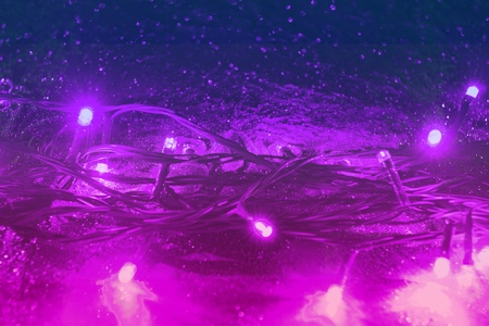 nice pink new year wreath sparks holiday bokeh texture - abstract photo backgroundの写真素材