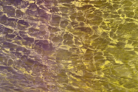 fantastic grunge yellow shiny lake water texture - abstract photo backgroundの写真素材