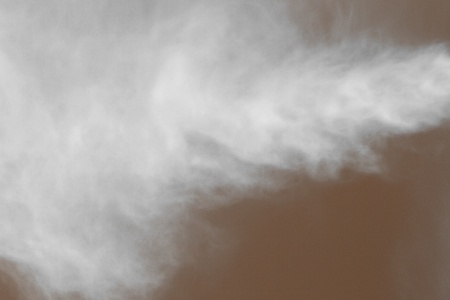 pretty orange water mist in the air close-up texture - abstract photo background