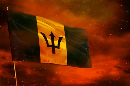 Fluttering Barbados flag on crimson red sky with smoke pillars background. Barbados problems concept.の写真素材